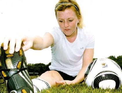 Jenny Graham stretches before practice 